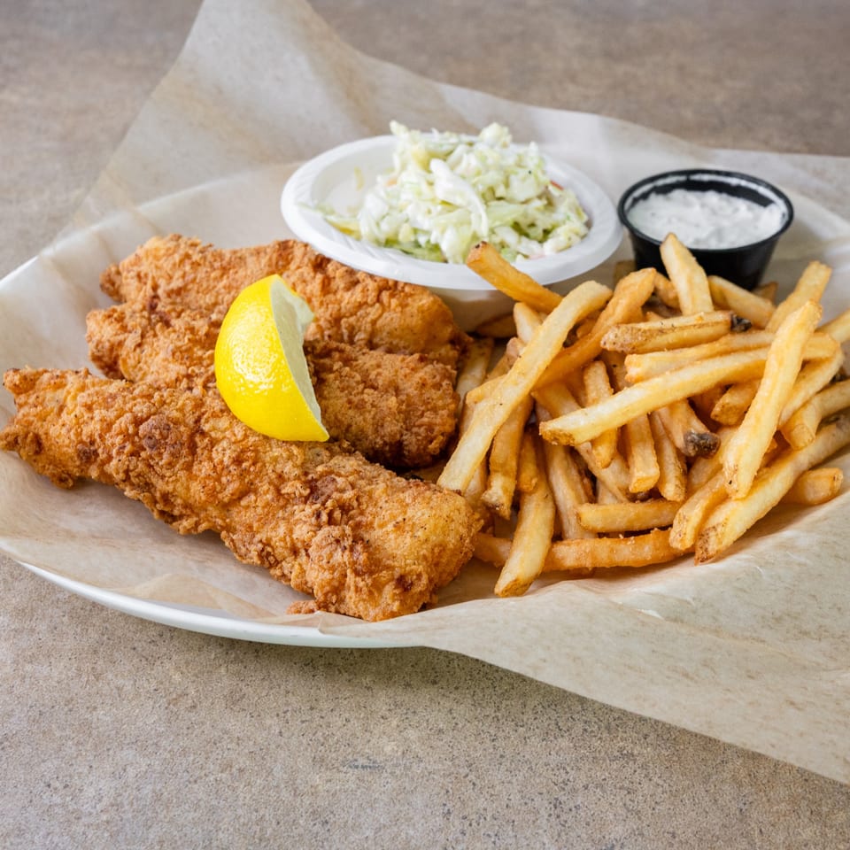 Fish sticks with fries and coleslaw.